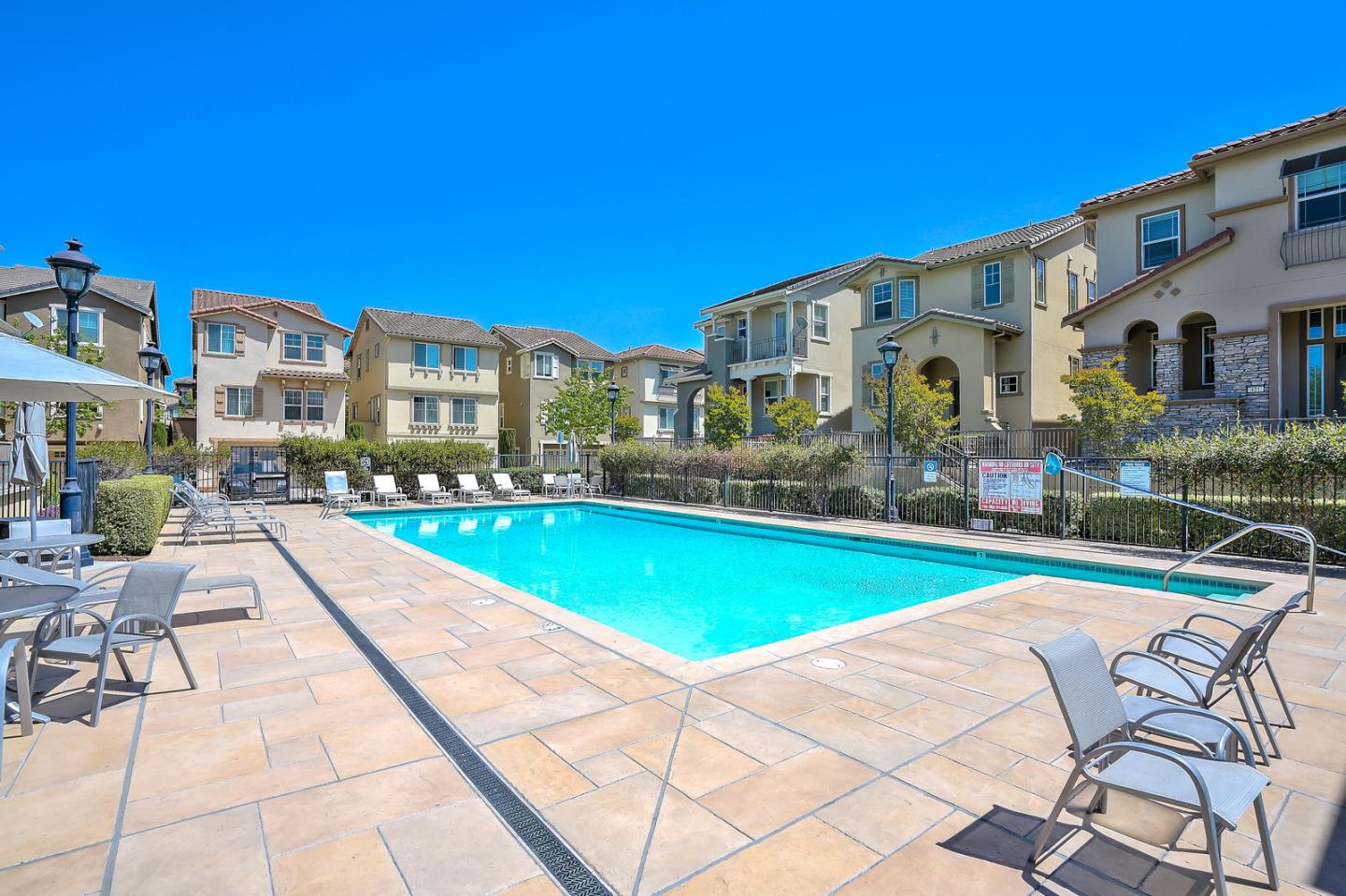 1088 Vida Larga Loop Milpitas, CA 95035 - Photo 28 of 29 a view of swimming pool with outdoor seating and yard
