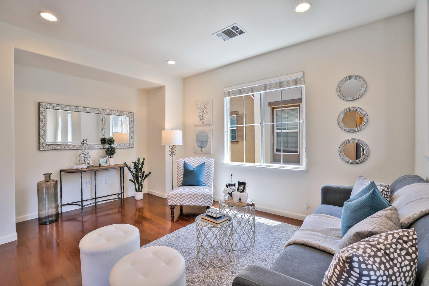 1088 Vida Larga Loop Milpitas, CA 95035 - Photo 4 of 29 a living room with furniture and a large window