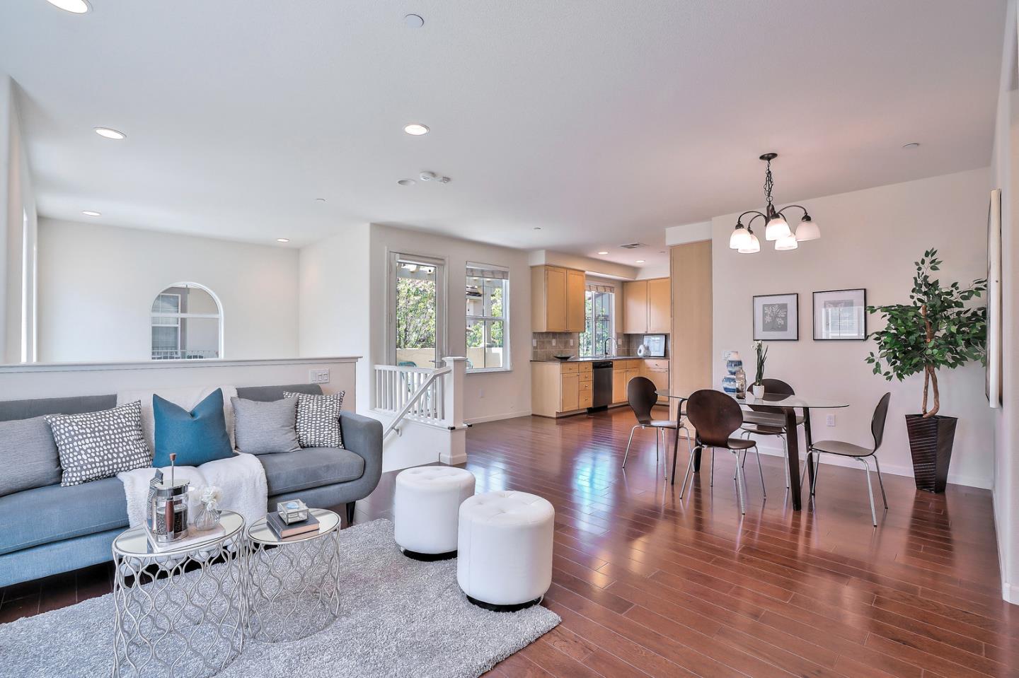 1088 Vida Larga Loop Milpitas, CA 95035 - Photo 5 of 29 a living room with furniture and a chandelier