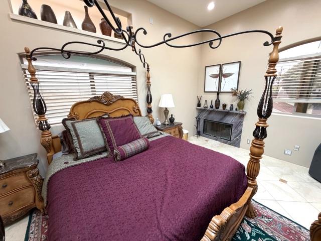 131 30th Avenue Santa Cruz, CA 95062 - Photo 23 of 29 a bedroom with a bed a mirror on dresser and a window