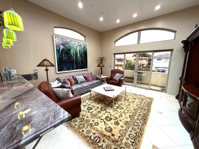 131 30th Avenue Santa Cruz, CA 95062 - Photo 5 of 29 a living room with furniture and a flat screen tv