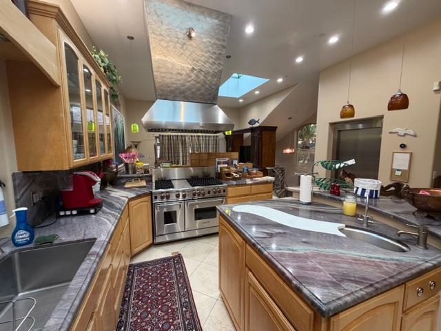 131 30th Avenue Santa Cruz, CA 95062 - Photo 10 of 29 a kitchen with stainless steel appliances granite countertop a sink stove and refrigerator