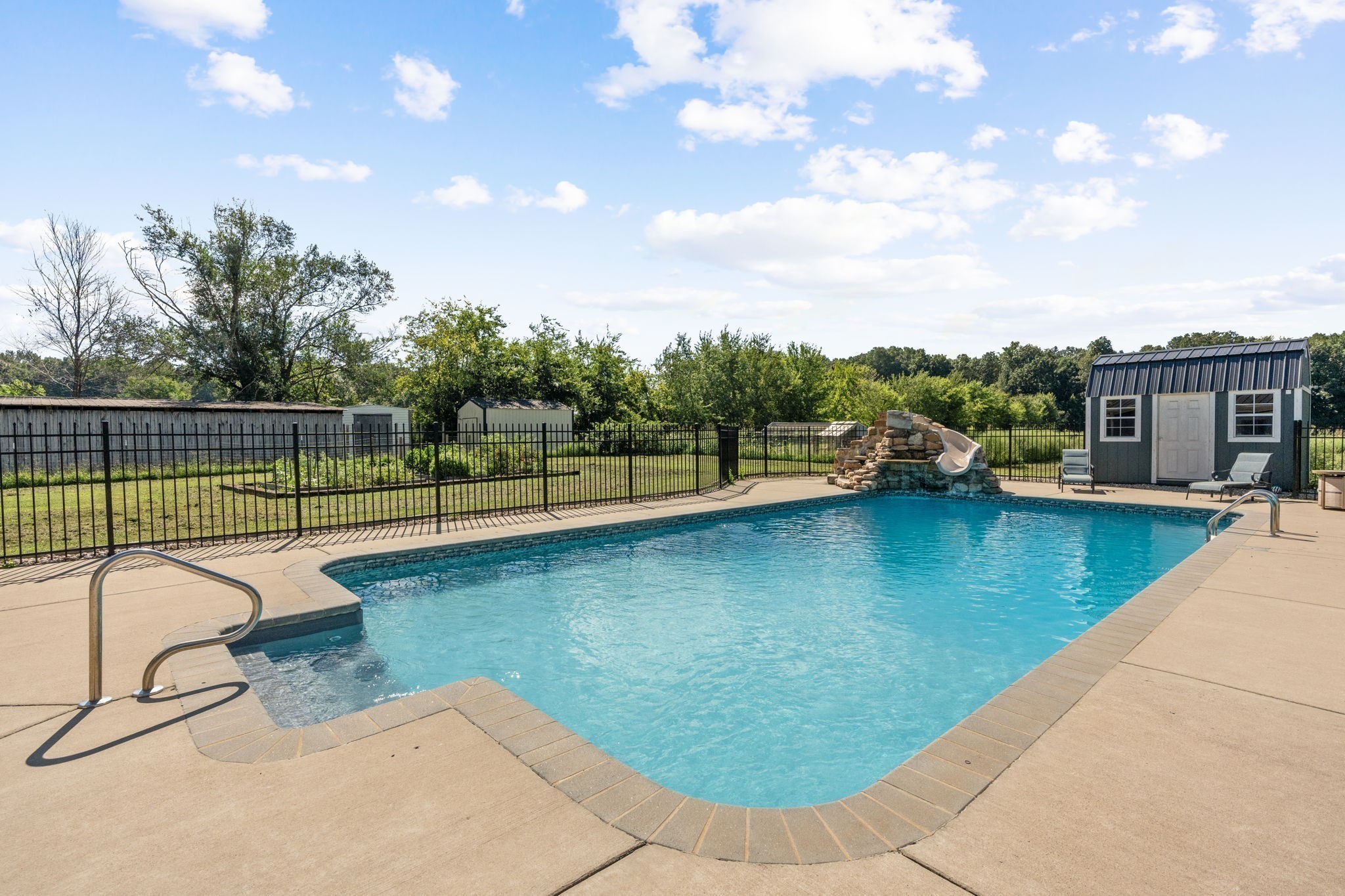 6931 Cowan Road Springfield, TN 37172 - Photo 14 of 68 a view of a swimming pool with a lounge chair