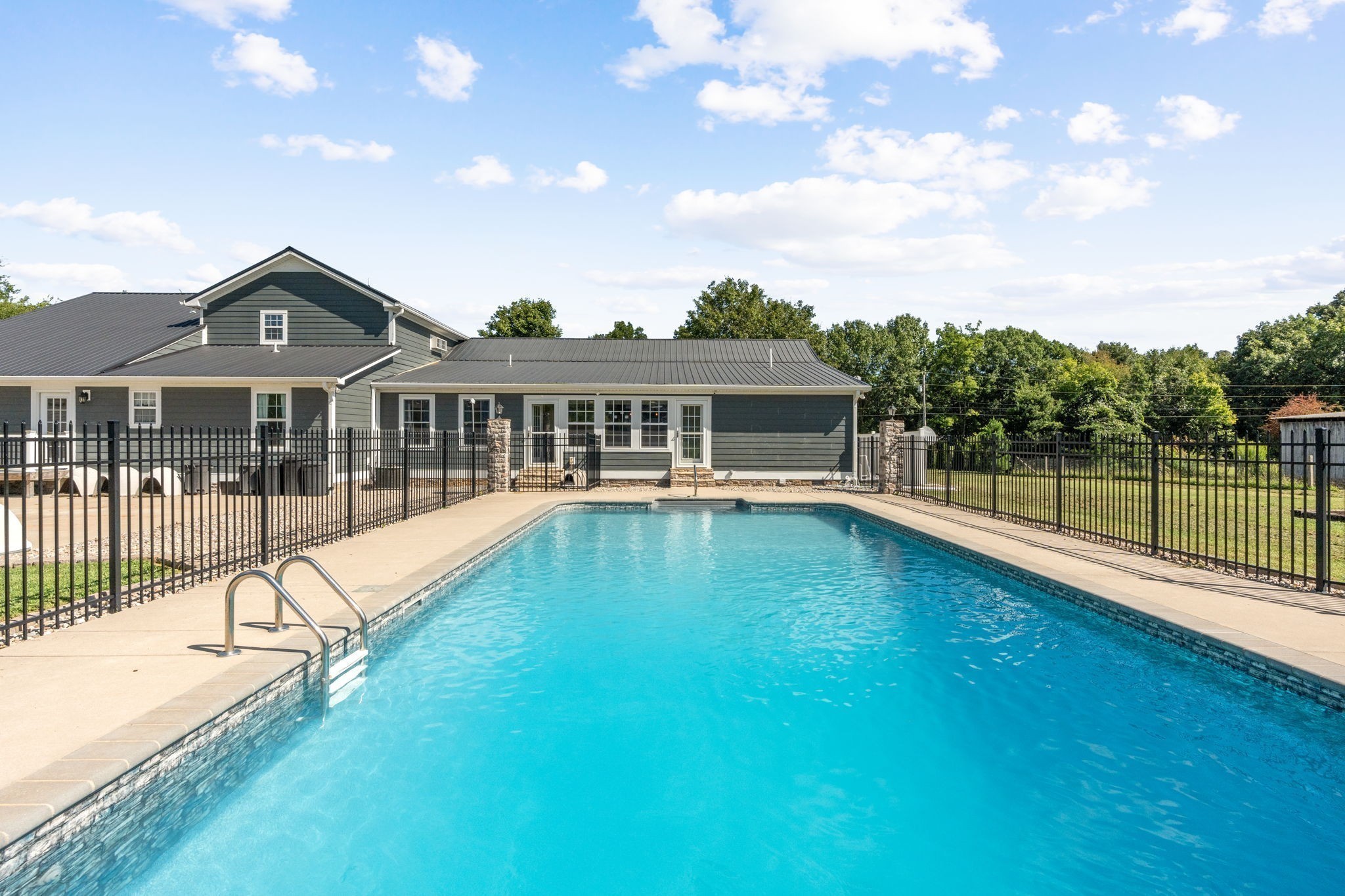 6931 Cowan Road Springfield, TN 37172 - Photo 15 of 68 a view of a house with a swimming pool