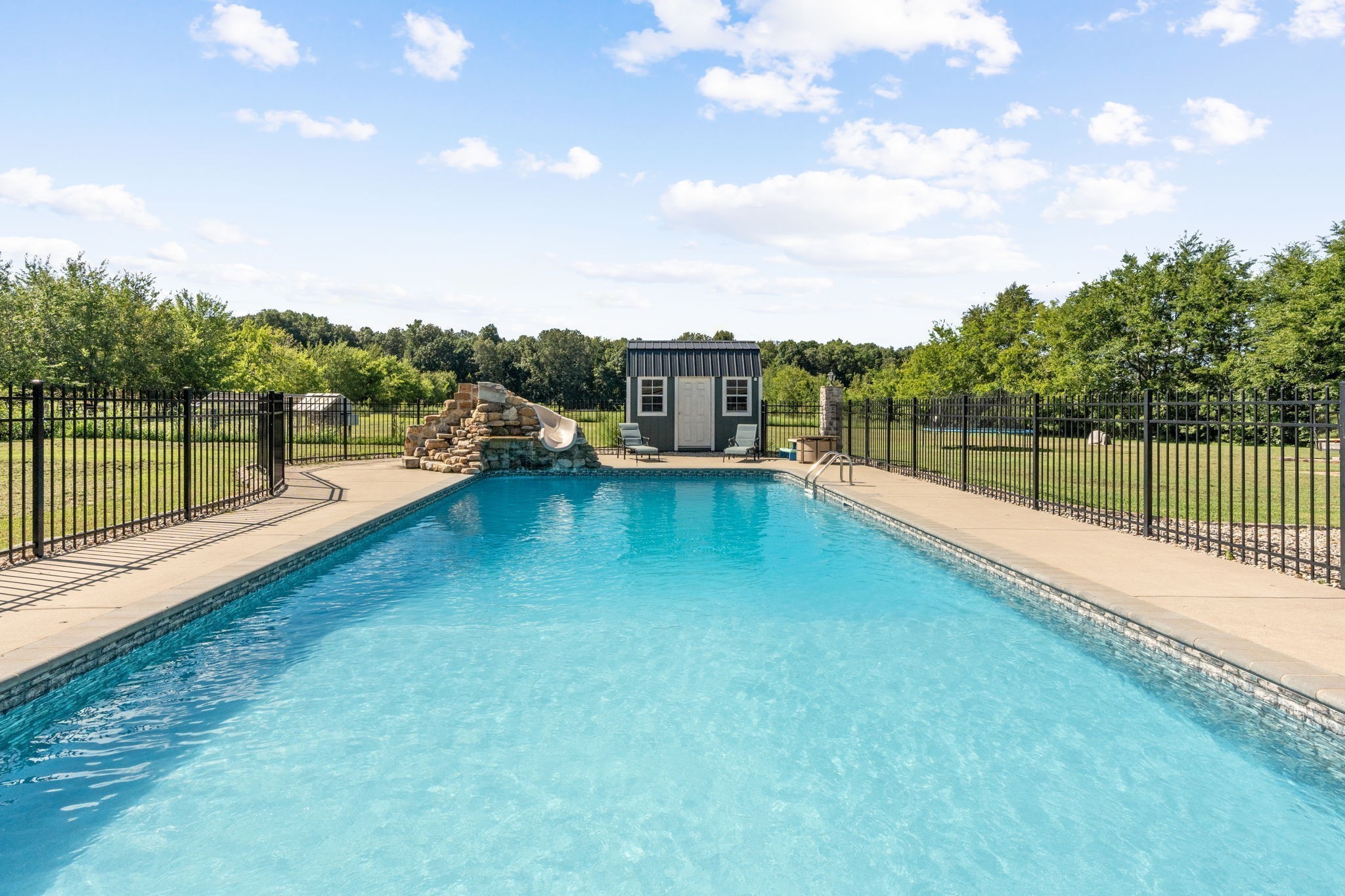 6931 Cowan Road Springfield, TN 37172 - Photo 16 of 68 a view of a swimming pool with a patio and a yard