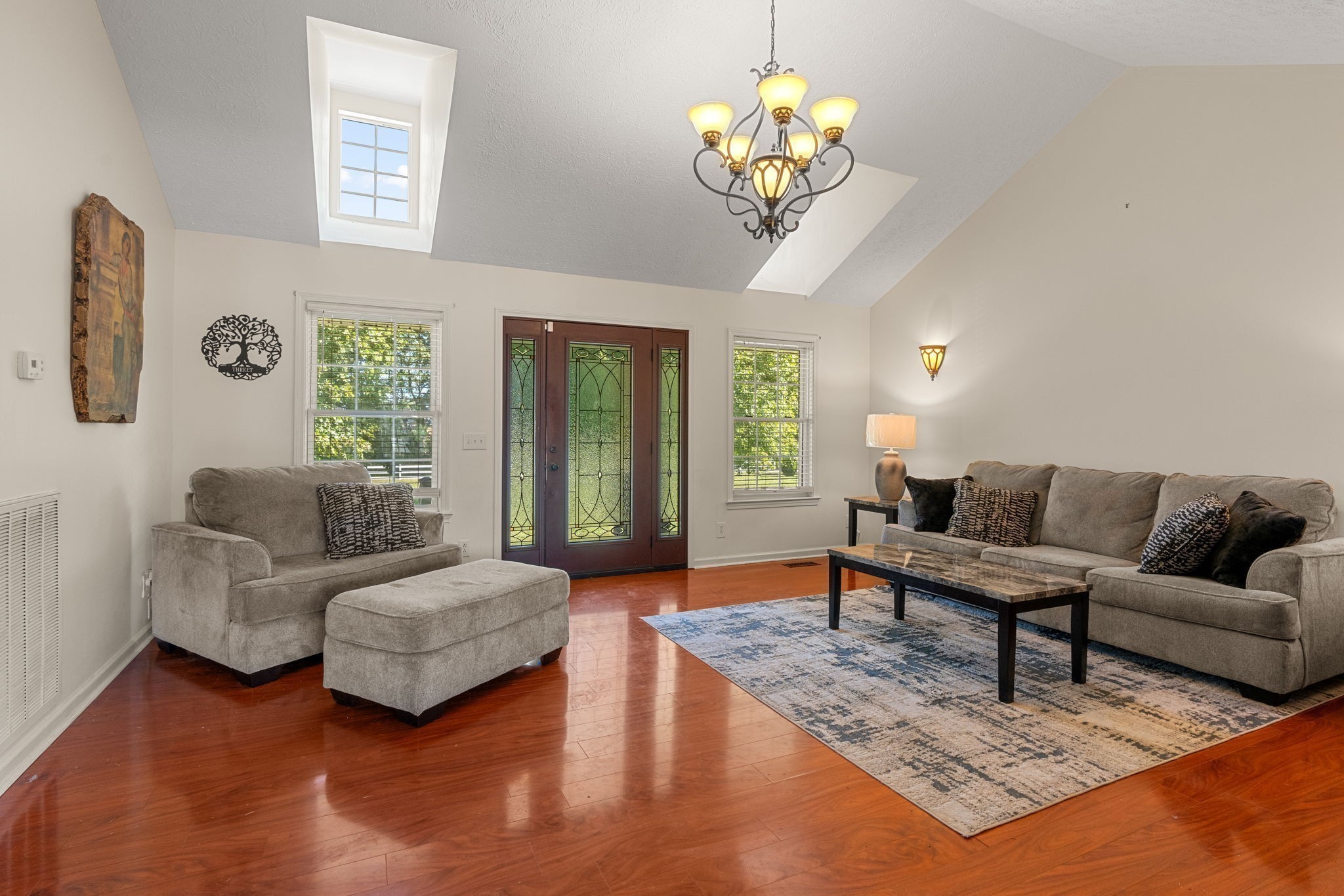 6931 Cowan Road Springfield, TN 37172 - Photo 21 of 68 a living room with furniture chandelier and a large window