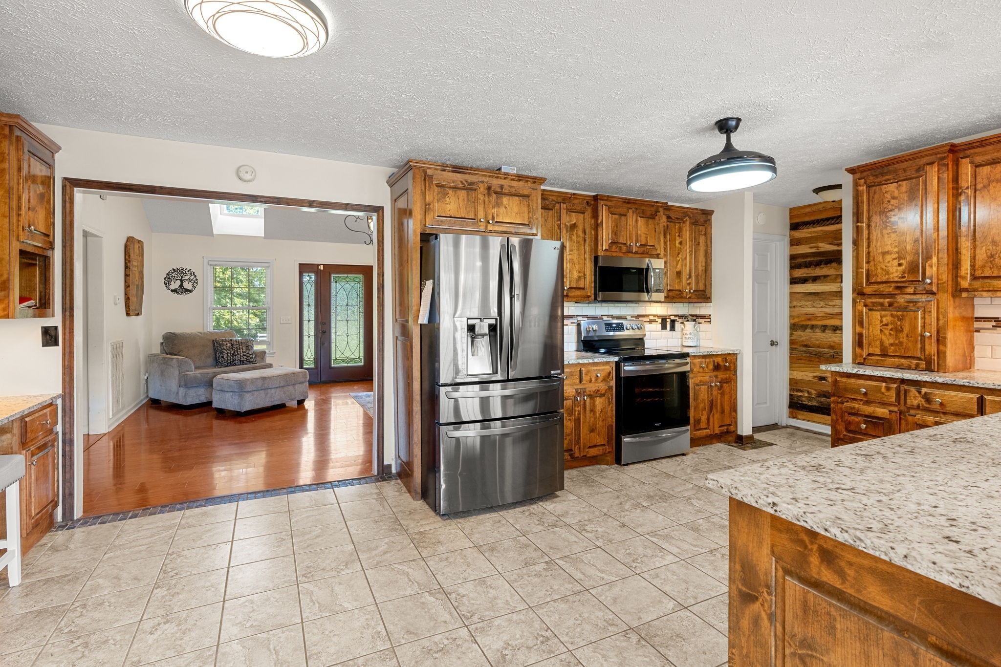 6931 Cowan Road Springfield, TN 37172 - Photo 24 of 68 a kitchen with granite countertop a refrigerator oven a sink and dishwasher