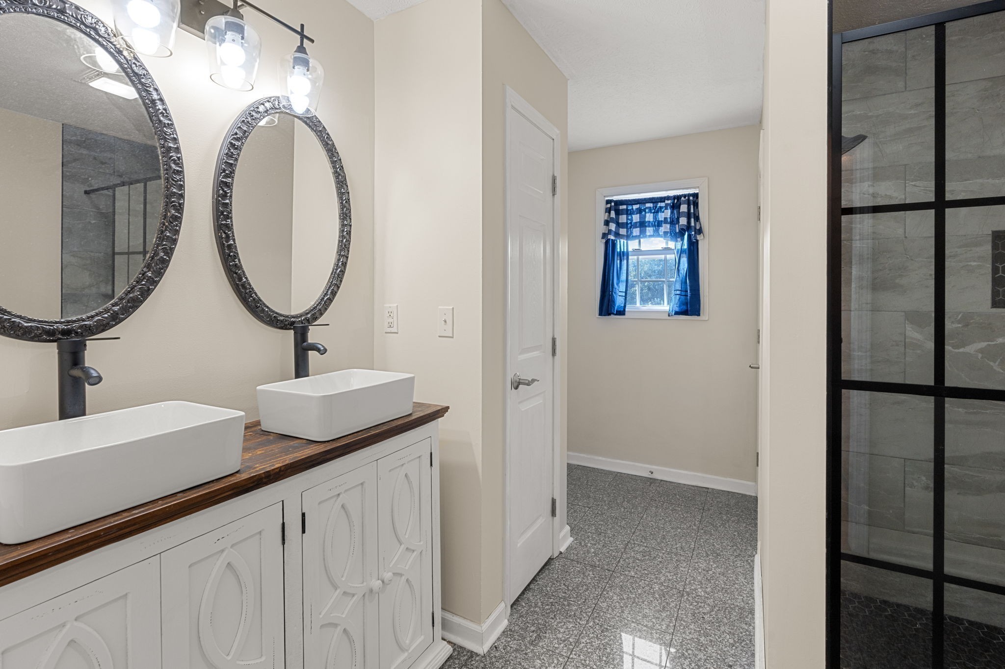 6931 Cowan Road Springfield, TN 37172 - Photo 36 of 68 a bathroom with a sink and a mirror