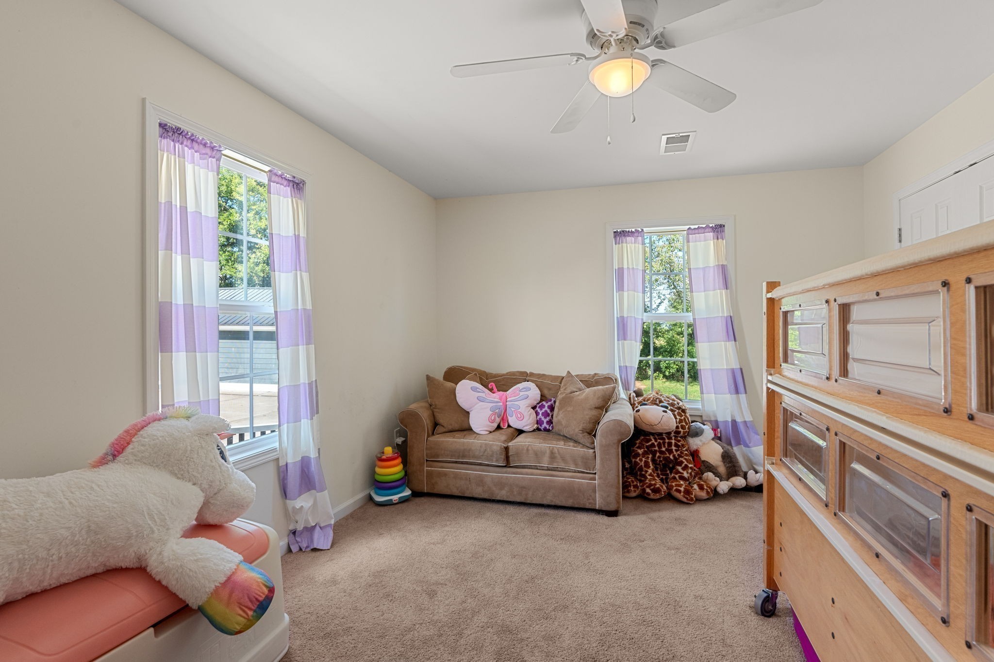 6931 Cowan Road Springfield, TN 37172 - Photo 42 of 68 a living room with furniture and a chandelier
