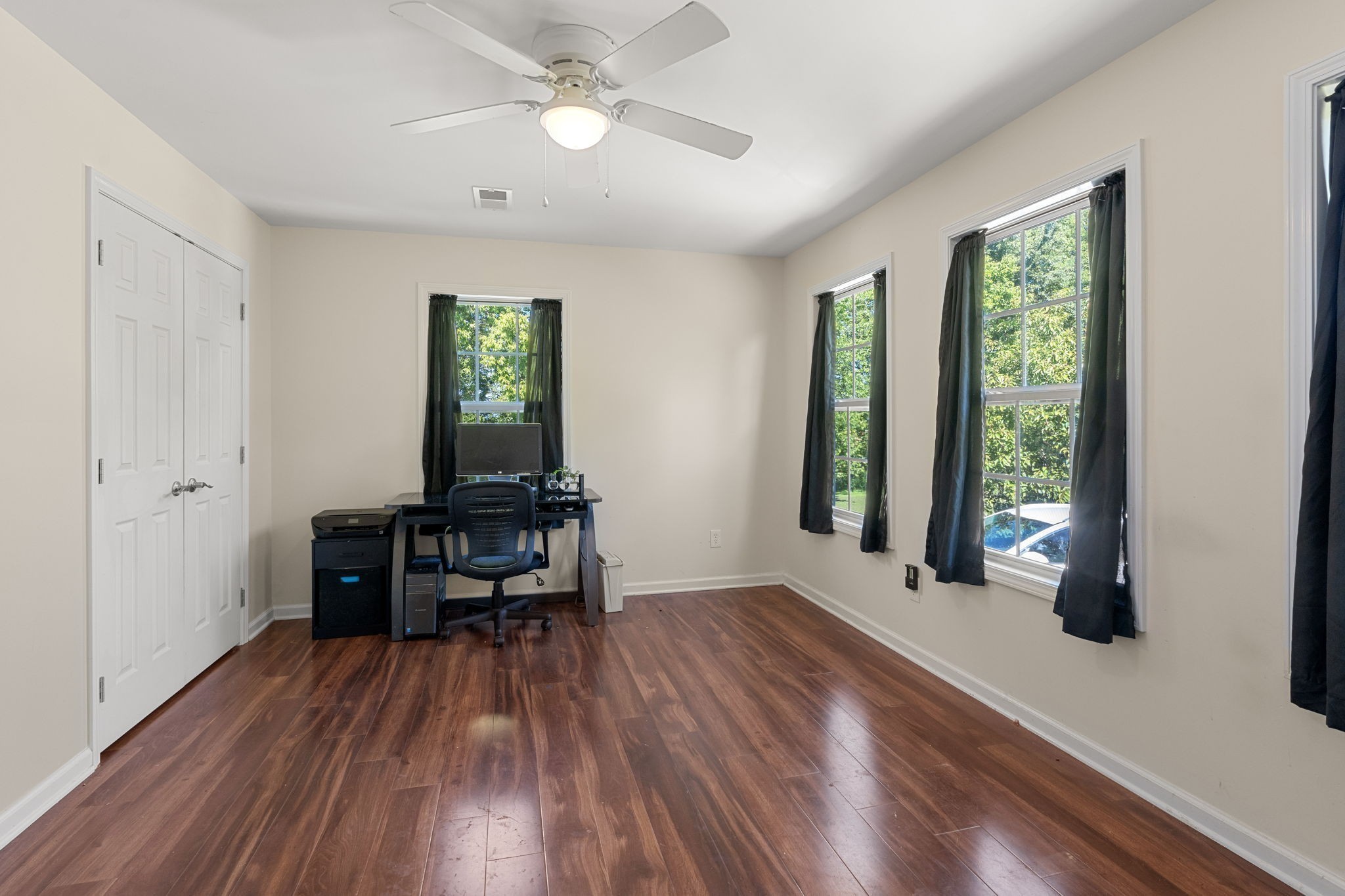 6931 Cowan Road Springfield, TN 37172 - Photo 51 of 68 a view of a room with wooden floor a ceiling fan and windows