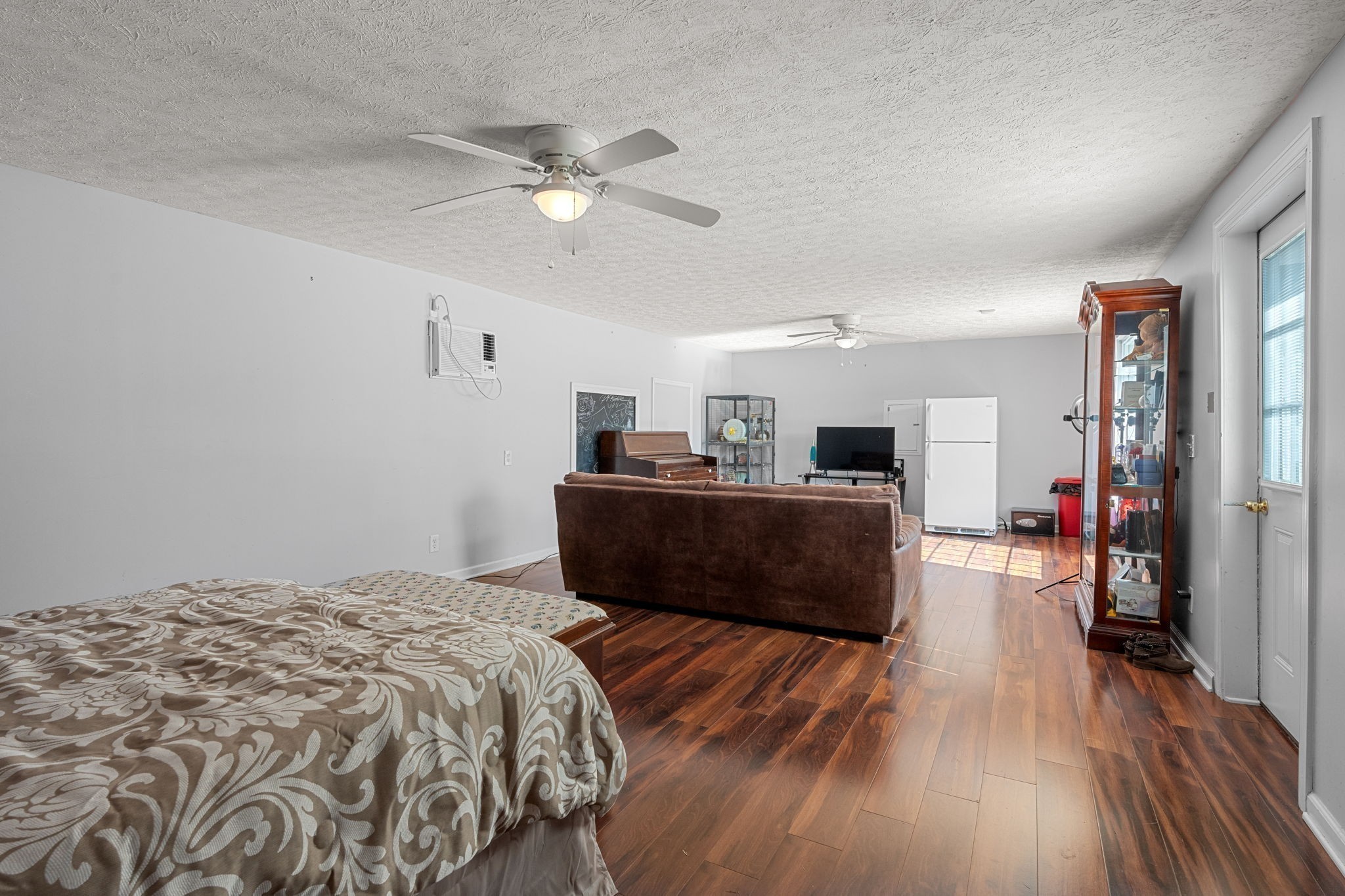 6931 Cowan Road Springfield, TN 37172 - Photo 59 of 68 a bedroom with a bed and a chandelier