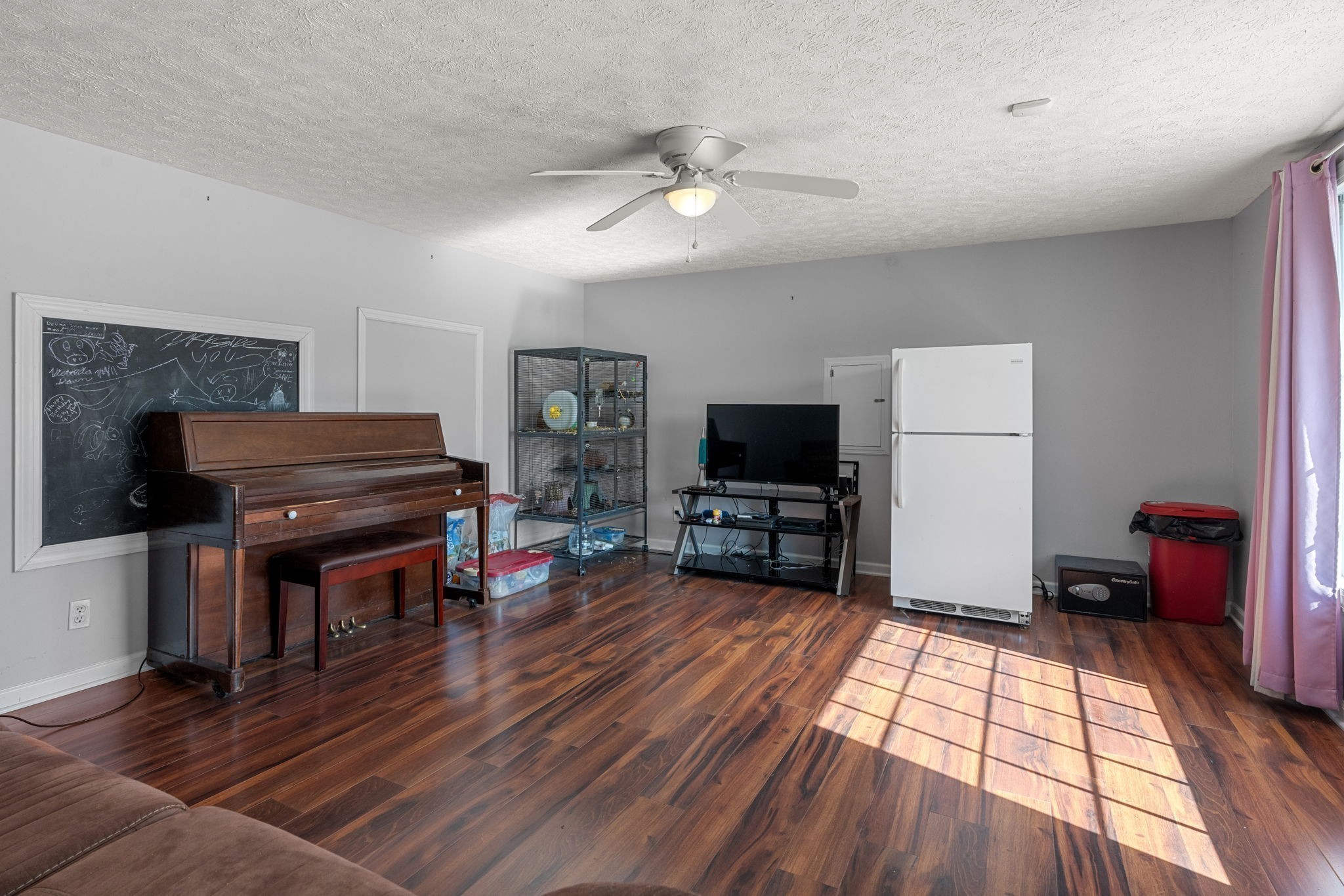 6931 Cowan Road Springfield, TN 37172 - Photo 60 of 68 a living room with furniture and a flat screen tv