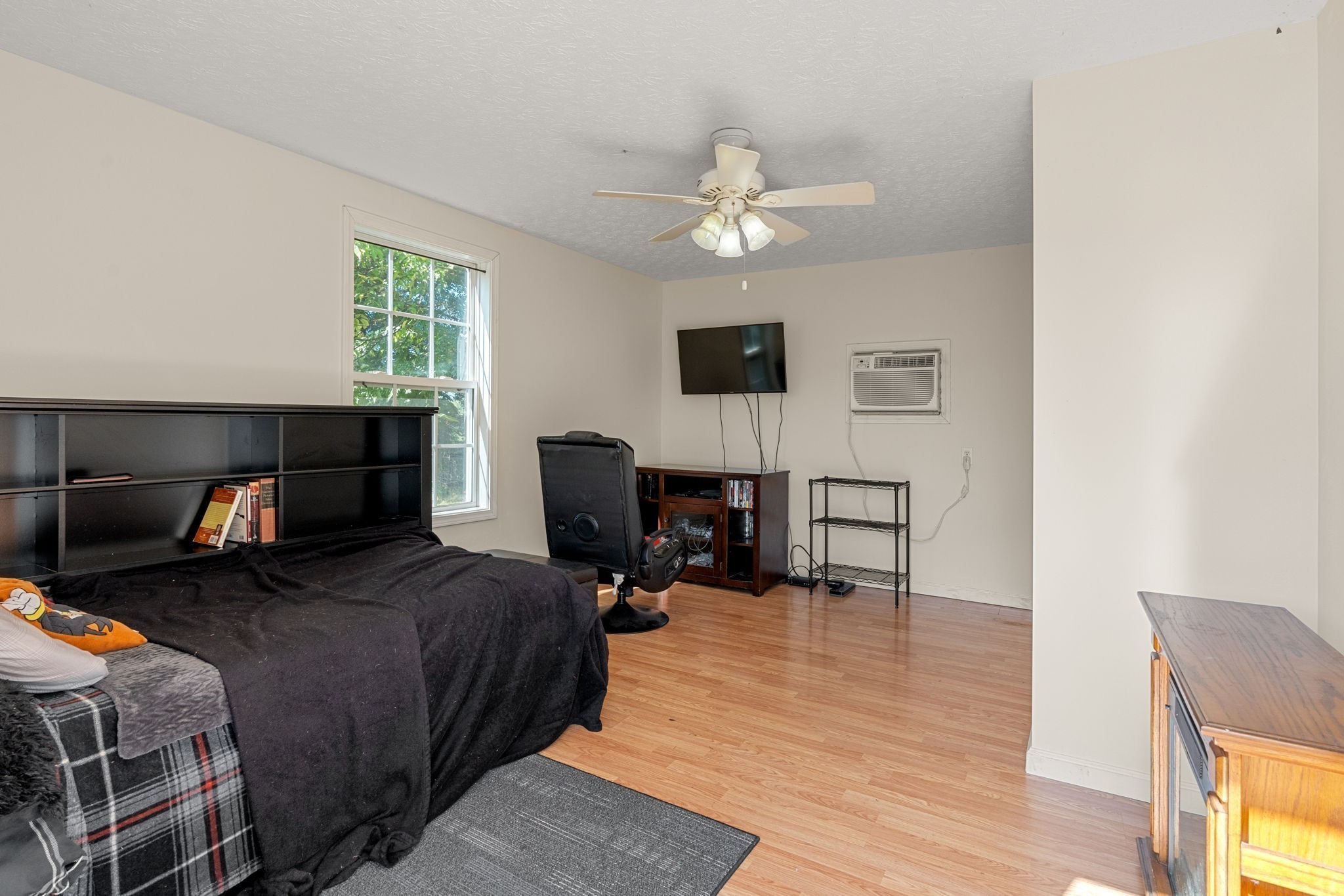 6931 Cowan Road Springfield, TN 37172 - Photo 65 of 68 a bedroom with a bed and a chandelier
