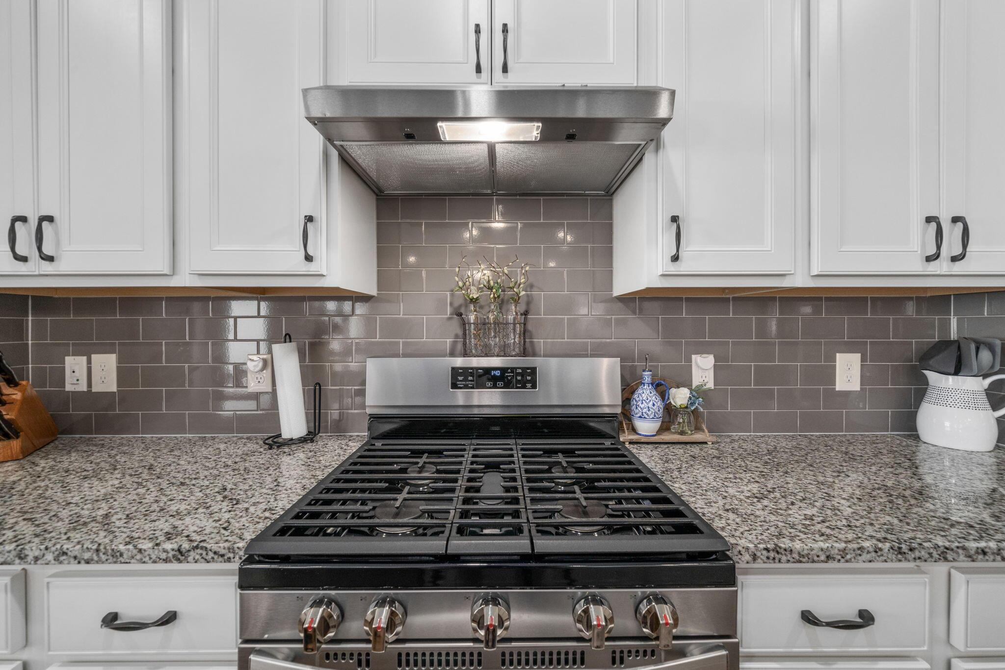 727 Fescue Road Galena, OH 43021 - Photo 13 of 85 Stainless steel gas range and stainless steel vent hood.
