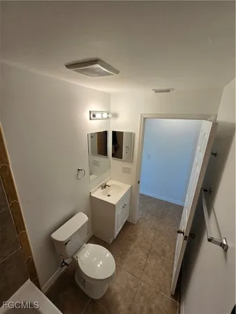 an empty room with windows and entrance