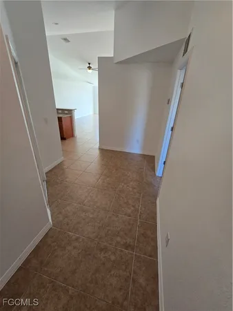 a kitchen with granite countertop a sink and a stove