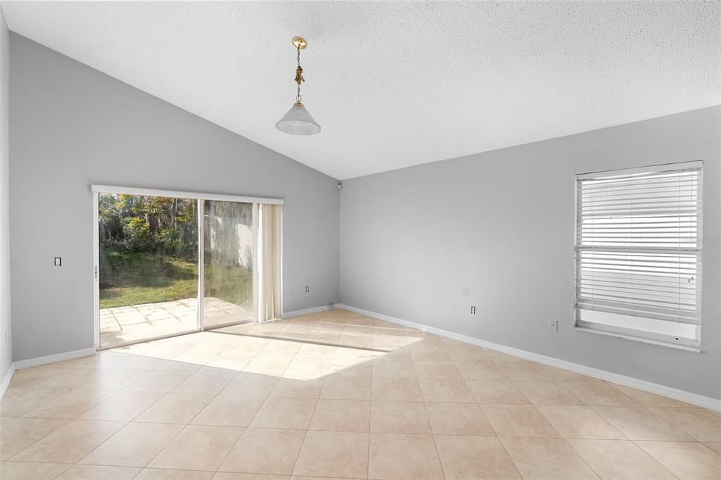 559 Saddle Ridge Drive Davenport, FL 33896 - Photo 13 of 42 a view of an empty room with a window