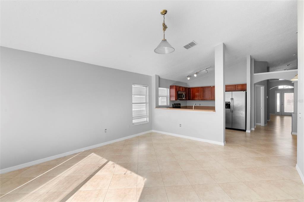 559 Saddle Ridge Drive Davenport, FL 33896 - Photo 17 of 42 a view of a kitchen with a sink and a window