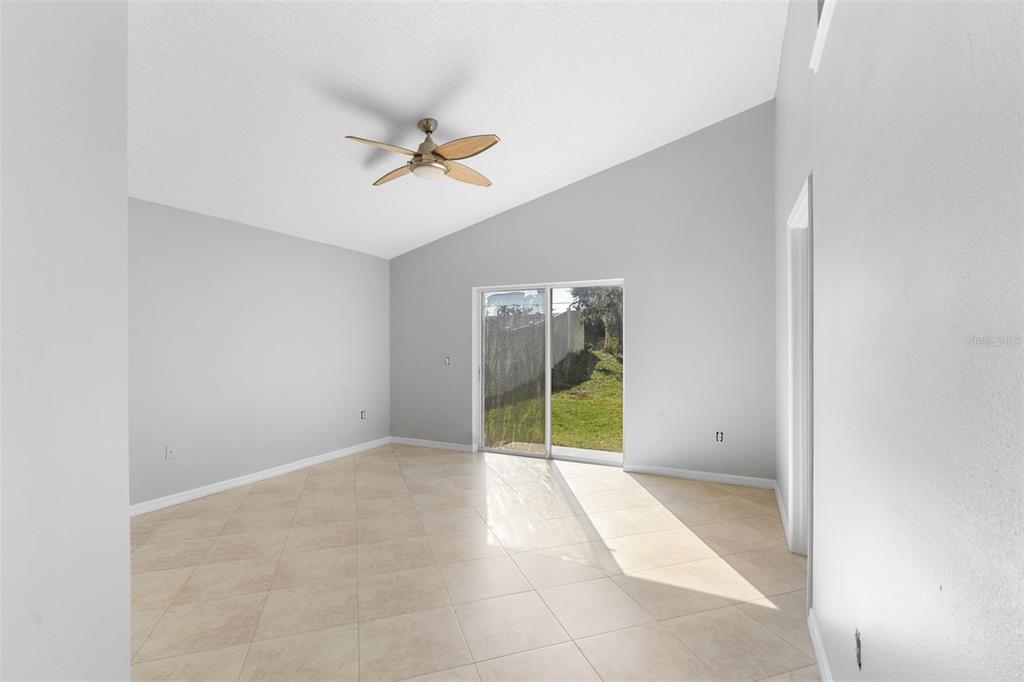 559 Saddle Ridge Drive Davenport, FL 33896 - Photo 18 of 42 an empty room with windows