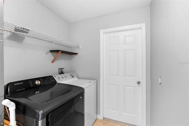 an empty room with windows and wooden floor