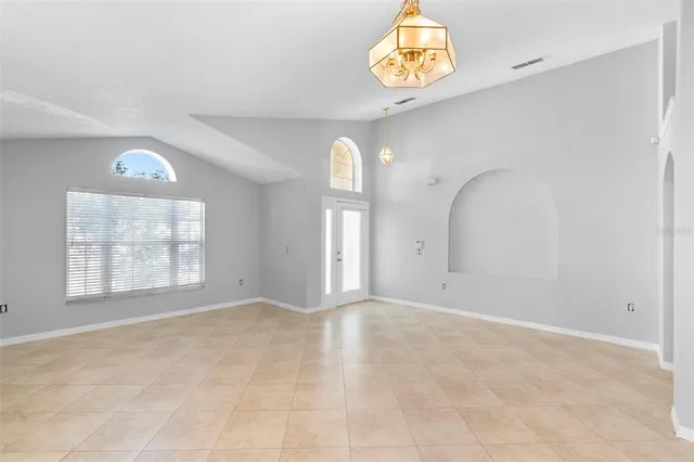 a view of an empty room with a window