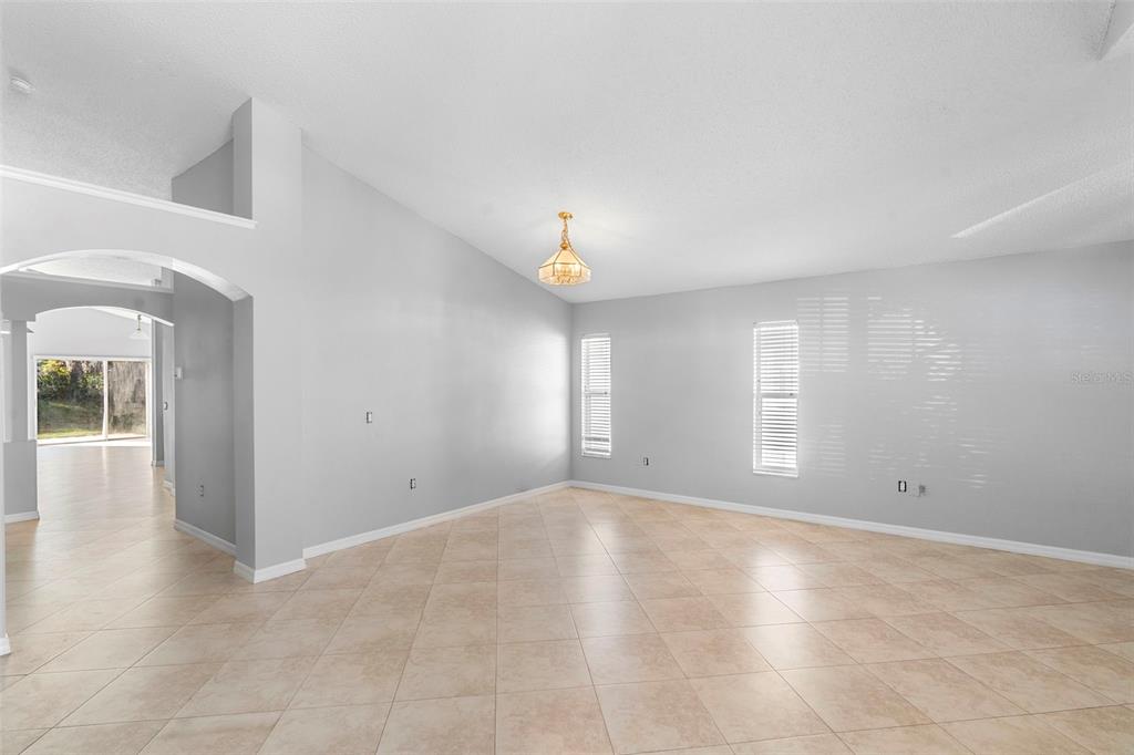 559 Saddle Ridge Drive Davenport, FL 33896 - Photo 33 of 42 a view of empty room with window and wooden floor