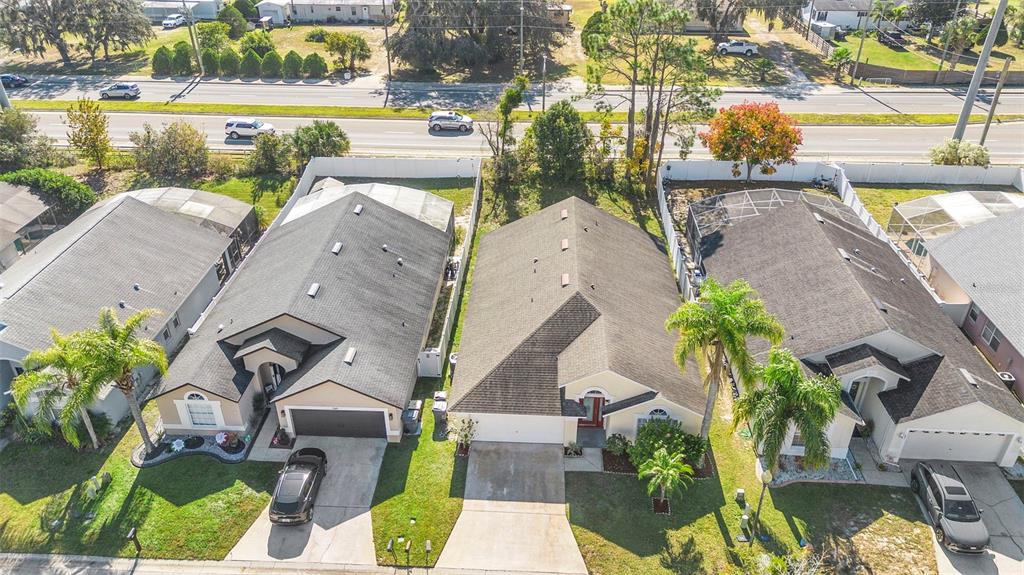 559 Saddle Ridge Drive Davenport, FL 33896 - Photo 5 of 42 an aerial view of a house with a garden and lake view