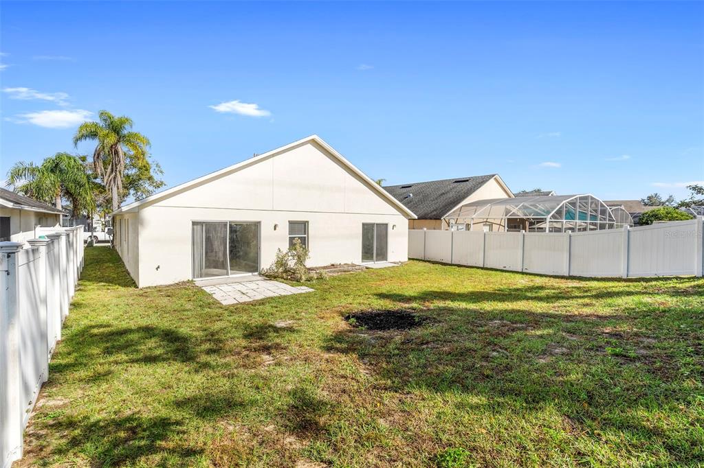 559 Saddle Ridge Drive Davenport, FL 33896 - Photo 7 of 42 a view of a house with pool and a yard
