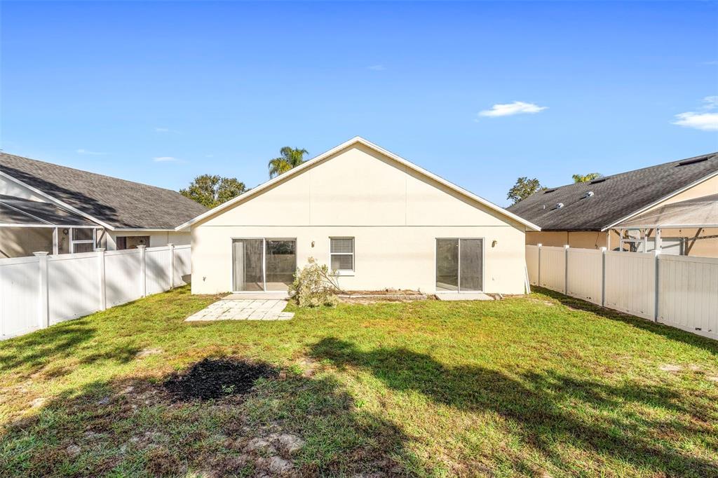 559 Saddle Ridge Drive Davenport, FL 33896 - Photo 8 of 42 a view of a house with a yard