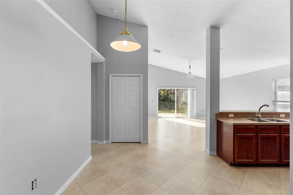 559 Saddle Ridge Drive Davenport, FL 33896 - Photo 10 of 42 a kitchen with a sink and a stove top oven