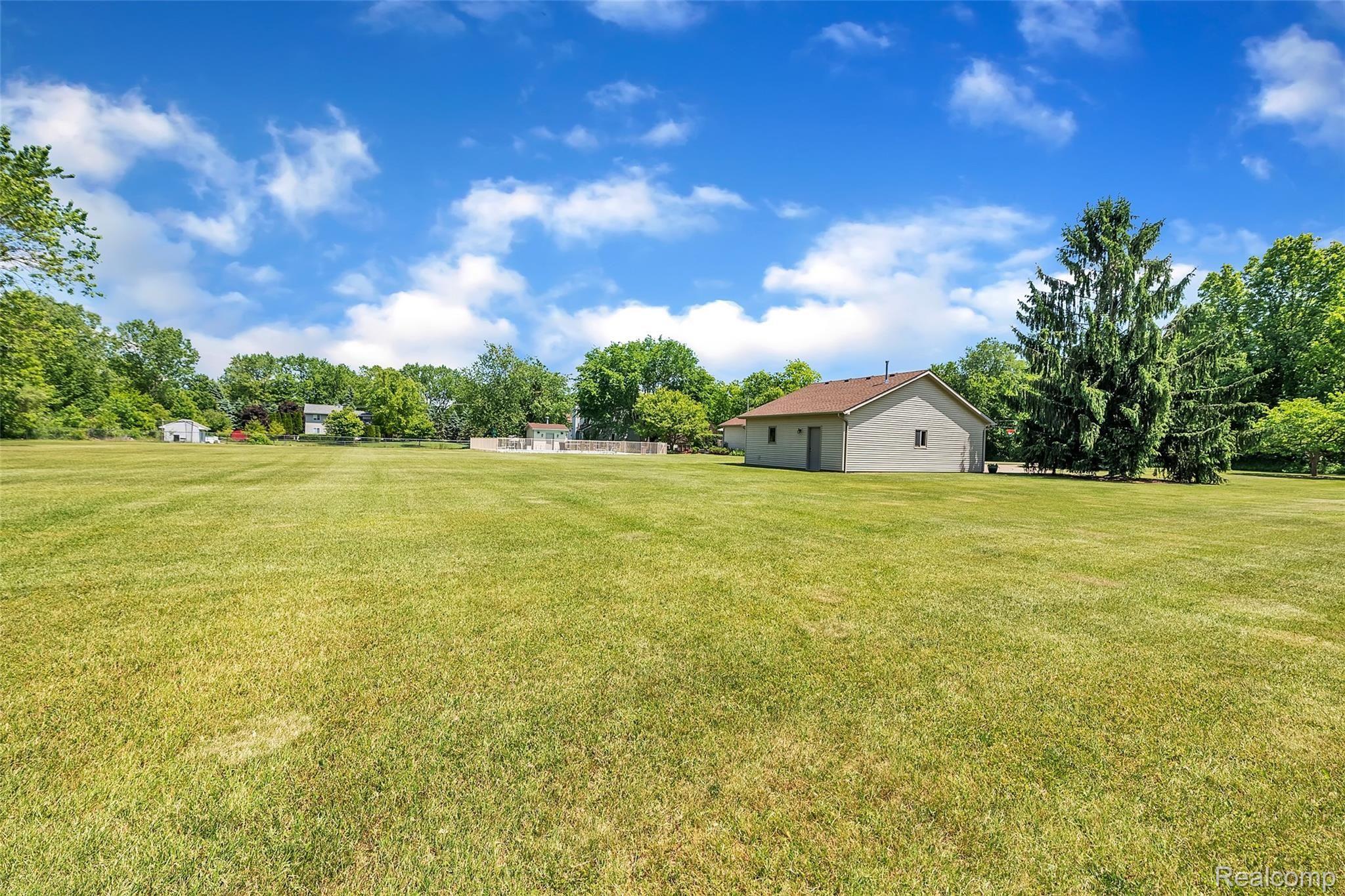 4054 Bennett Lake Road Fenton, MI 48430 - Photo 41 of 57 Pristine Landscaped Grounds & Lush Lawn