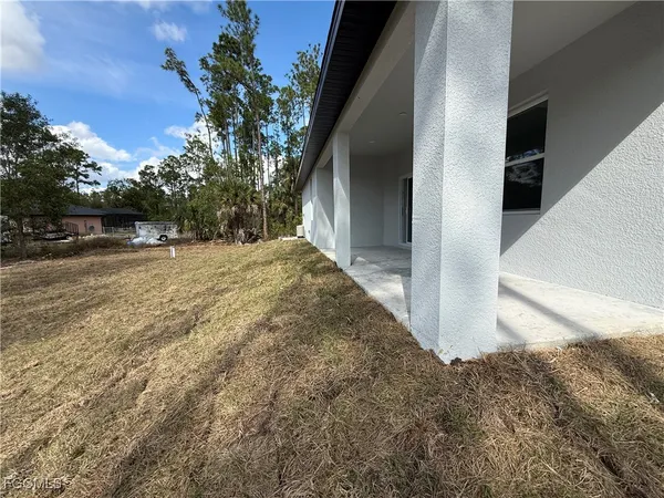 a view of a backyard of the house