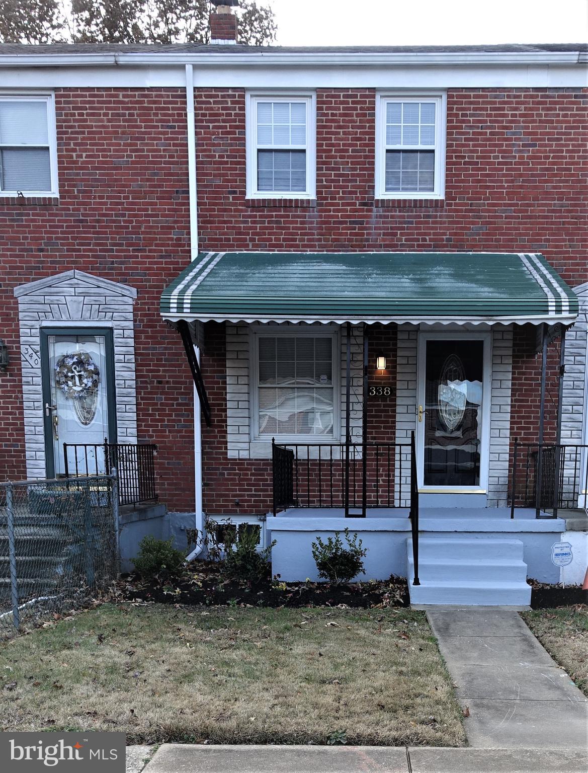 338 Grovethorn Road Baltimore, MD 21220 - Photo 1 of 24 a front view of a house with garden