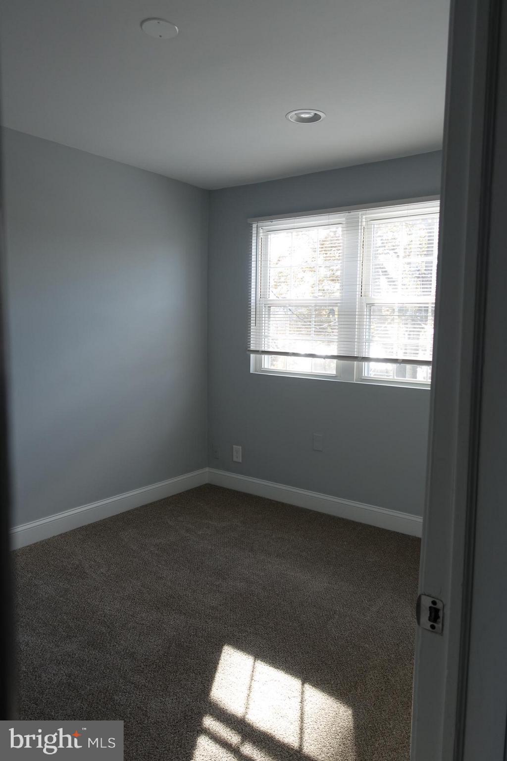 338 Grovethorn Road Baltimore, MD 21220 - Photo 12 of 24 an empty room with a window