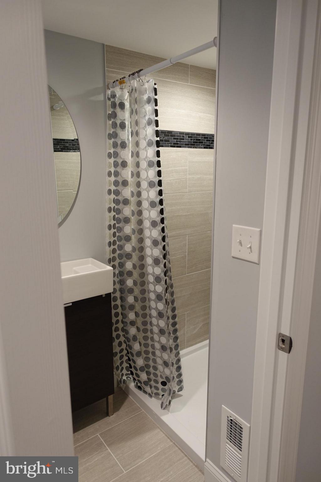 338 Grovethorn Road Baltimore, MD 21220 - Photo 20 of 24 a bathroom with a shower and a sink