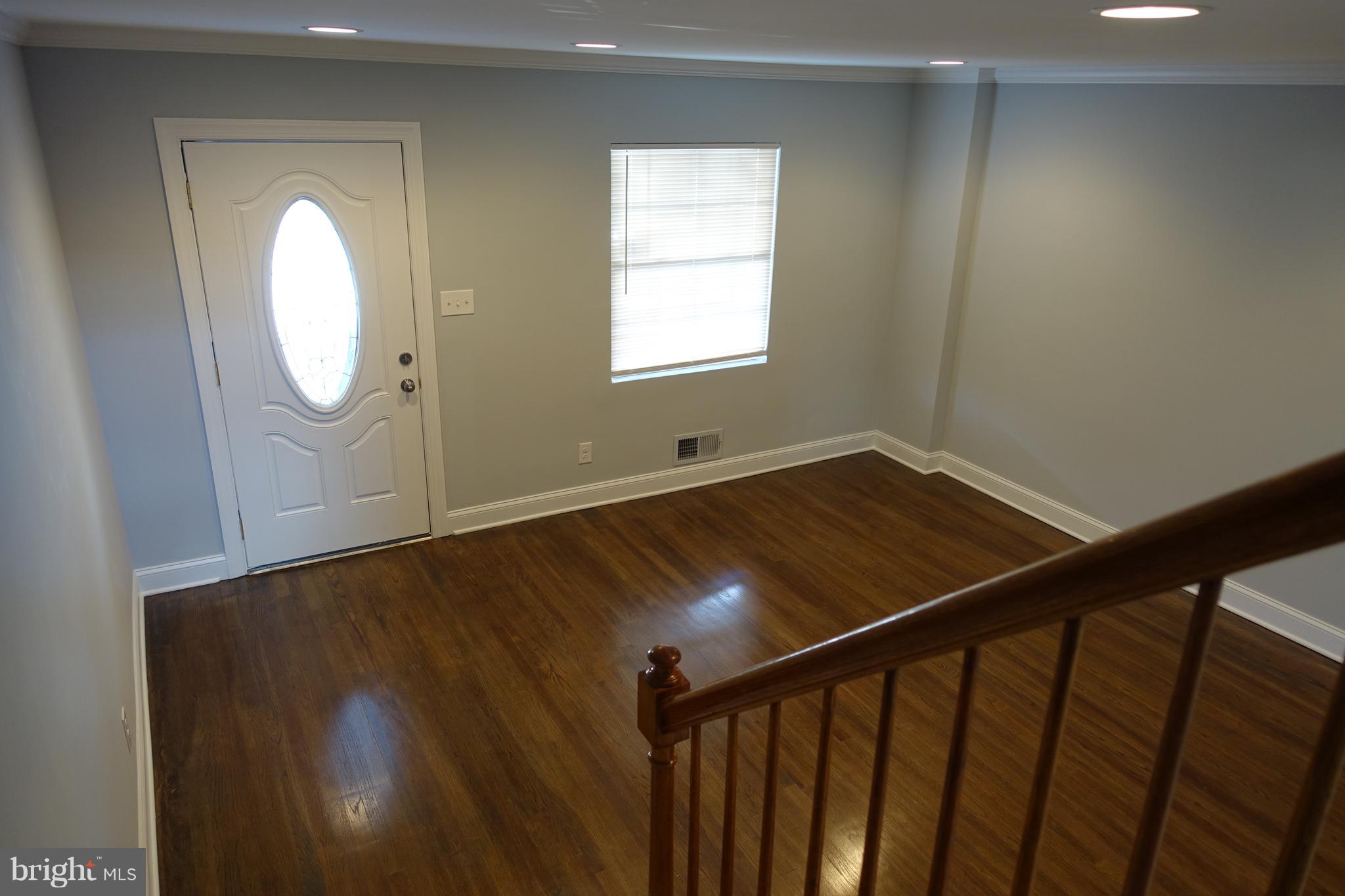338 Grovethorn Road Baltimore, MD 21220 - Photo 3 of 24 a view of a room with wooden floor and window