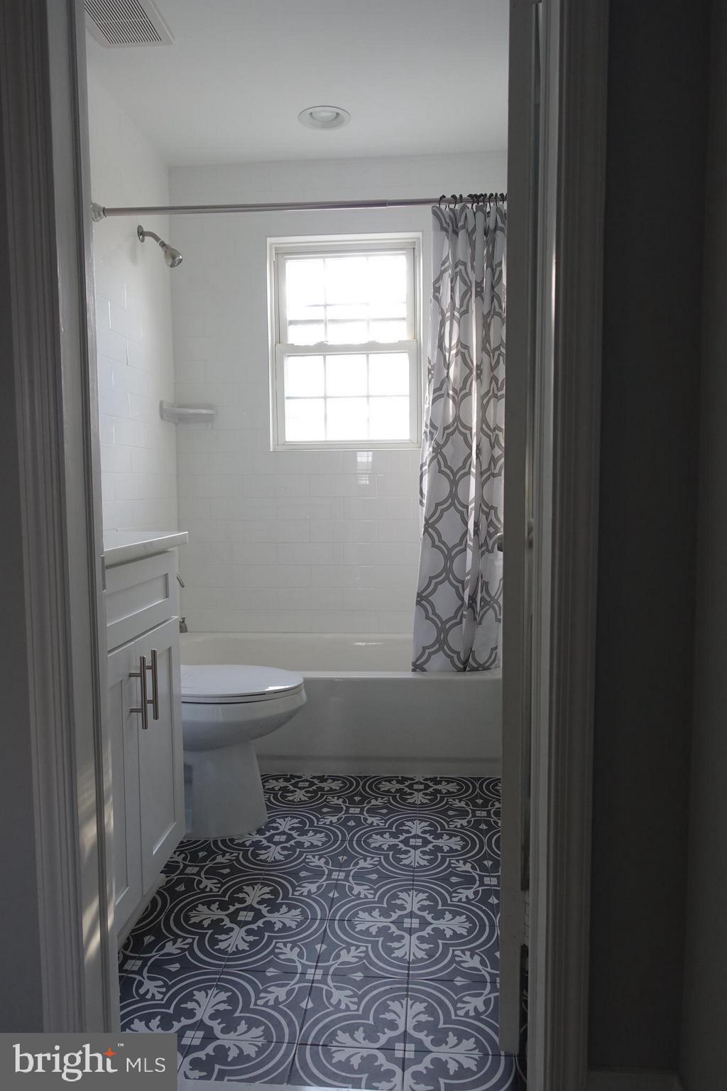 338 Grovethorn Road Baltimore, MD 21220 - Photo 9 of 24 a bathroom with a toilet and a shower
