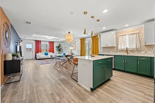 a kitchen with lots of counter top space and a sink