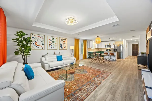 a living room with furniture and a table