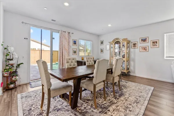 a white toilet sitting next to a bathroom sink and a window
