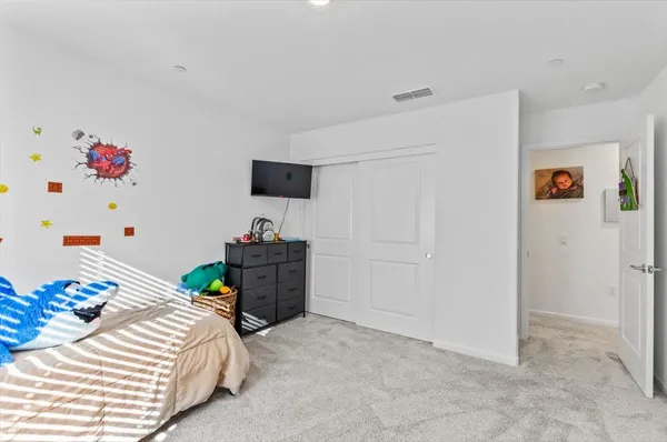 a bathroom with a double vanity sink toilet mirror and shower