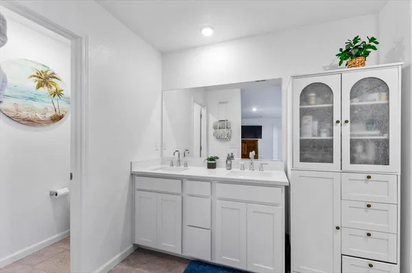 a bedroom with a bed and a tv