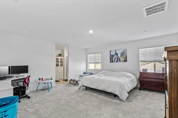 a bedroom with furniture and a bed