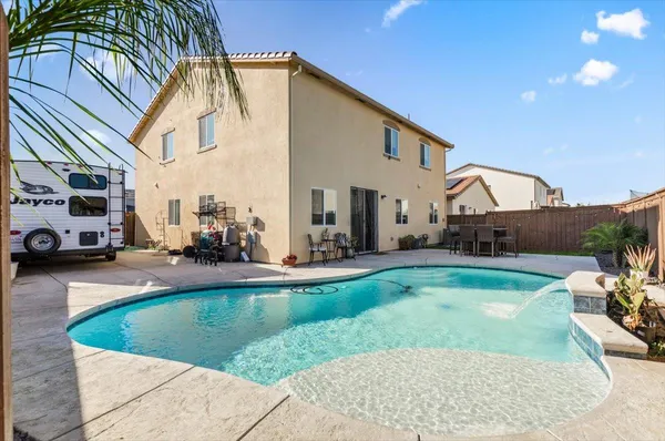 a view of a house with swimming pool
