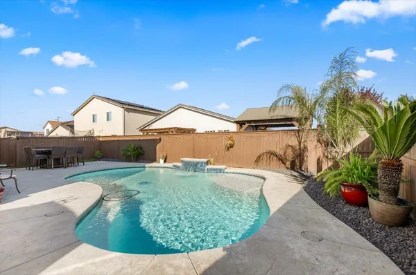 a view of a back yard of the house