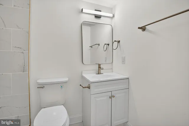 an empty room with wooden floor