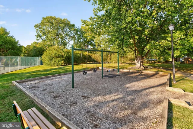 a kitchen with white cabinets and a sink