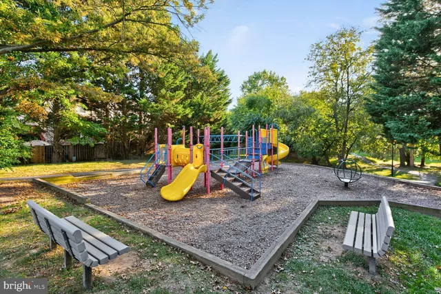 a kitchen with stainless steel appliances granite countertop a refrigerator and a window