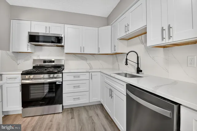 a view of a backyard with sitting area