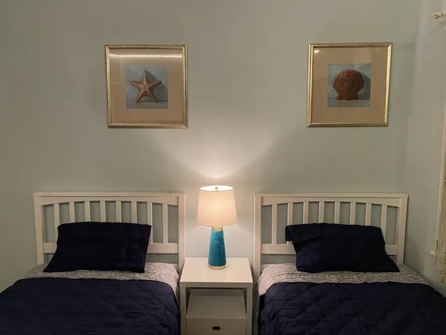 a bedroom with bed and window